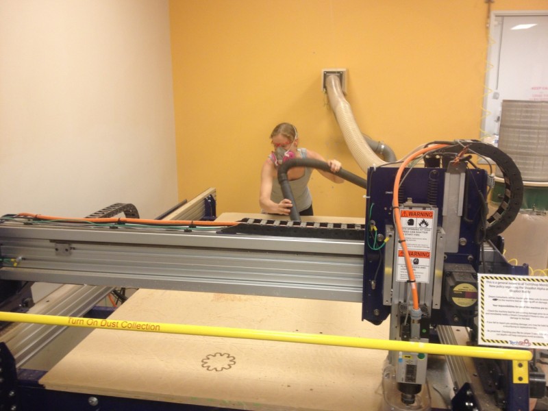 Me using the ShopBot to build the shelves (although in this picture, I'm really just cleaning up after)