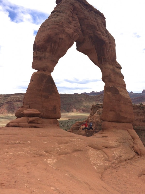 Jumping around at the base of the Delicate Arch (which is actually a long ways up, with a sheer drop just a few feet behind us)