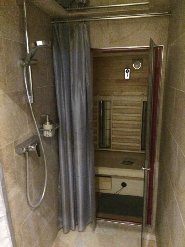 The beautiful tiled shower with a door to a private sauna in the back... all within our incredibly affordable apartment.