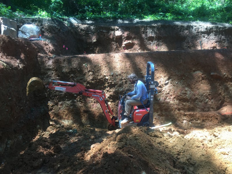 John trying to dig a trench for the footers using the Kuboto