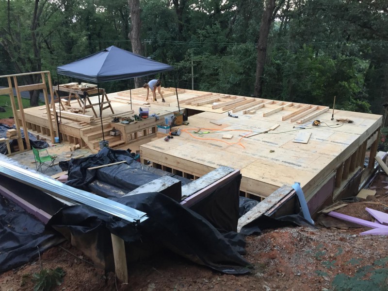 Me beginning work on the second floor. We constructed the flooring by placing advantech boards on top of 2x12" joists.