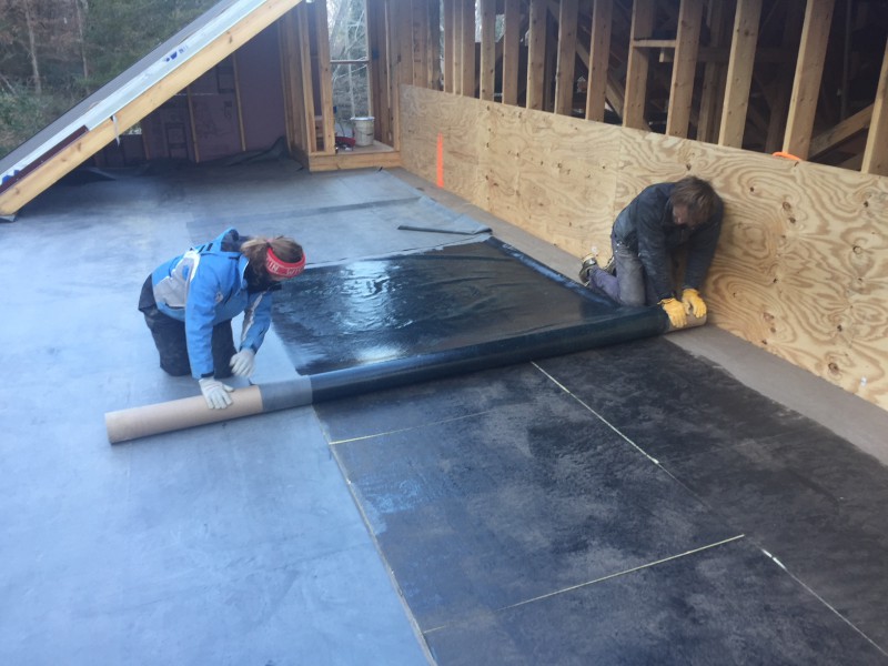 John and me rolling the EPDM back after applying the adhesive to both sides. It was tedious, because if any creases or bubbles appeared, the pieces were already stuck firmly together.