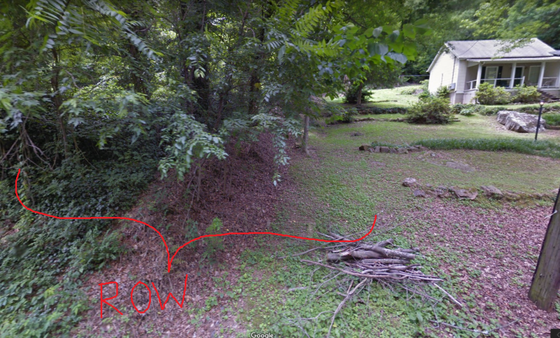 A view of our property before we ever broke ground. The location of the ROW is the overgrown tree-filled strip of land between our lot and our neighbor's.