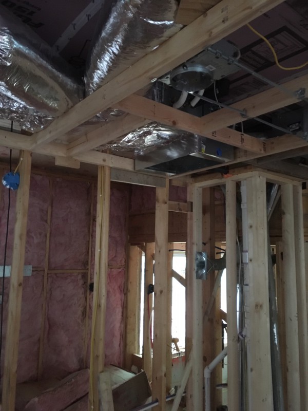 We added a drop ceiling and took out a corner of our master closet in order to run ducting.