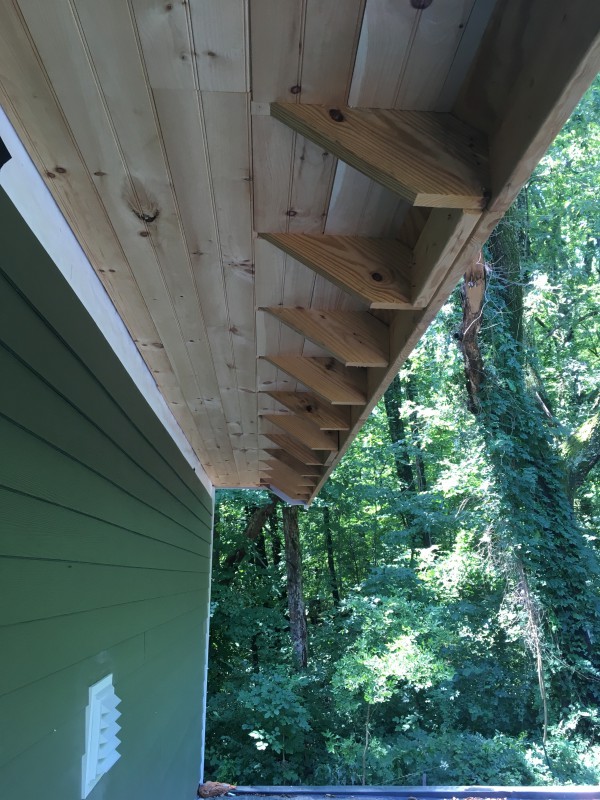 The upper part of the back porch. Individual boards were placed between each beam to make it appear as if it were one long piece.