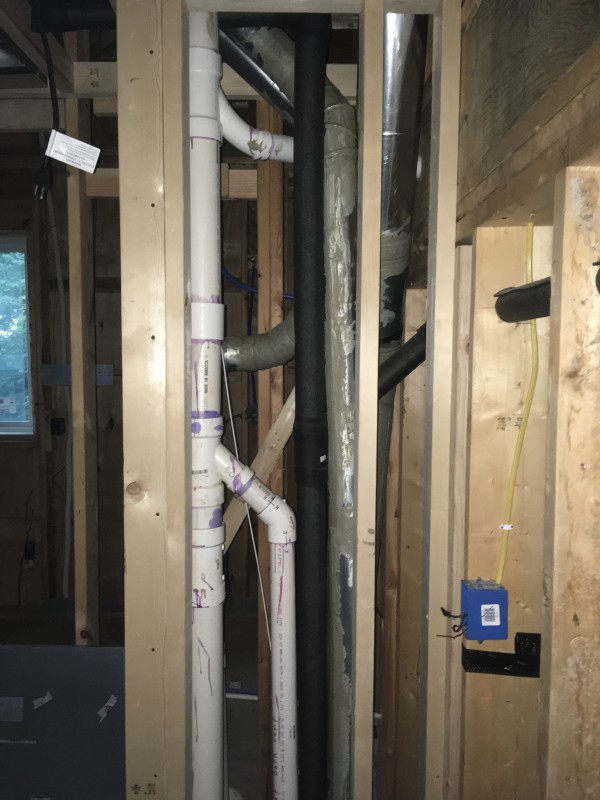 We had to take a corner out of the master closet in order to route sewage pipes and HVAC lines. One thing we didn't think about when designing our house was stacking walls over one another, so many of our lines have to take round-about paths to get between floors.