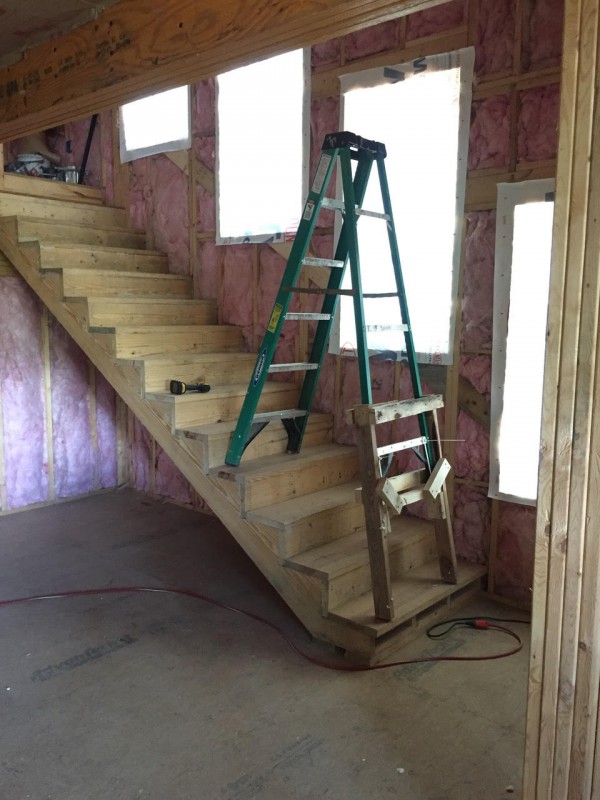 In order to spray-foam the tall ceiling above a staircase, John concocted this clearly not-at-all-sketchy contraption to allow us to use our cheap ladder on the stairs