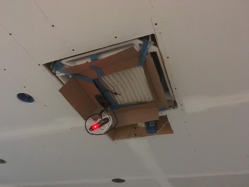 John rigged up some classy cardboard ventilation to allow us to keep the house warm for the drywall finishing while protecting the final cover