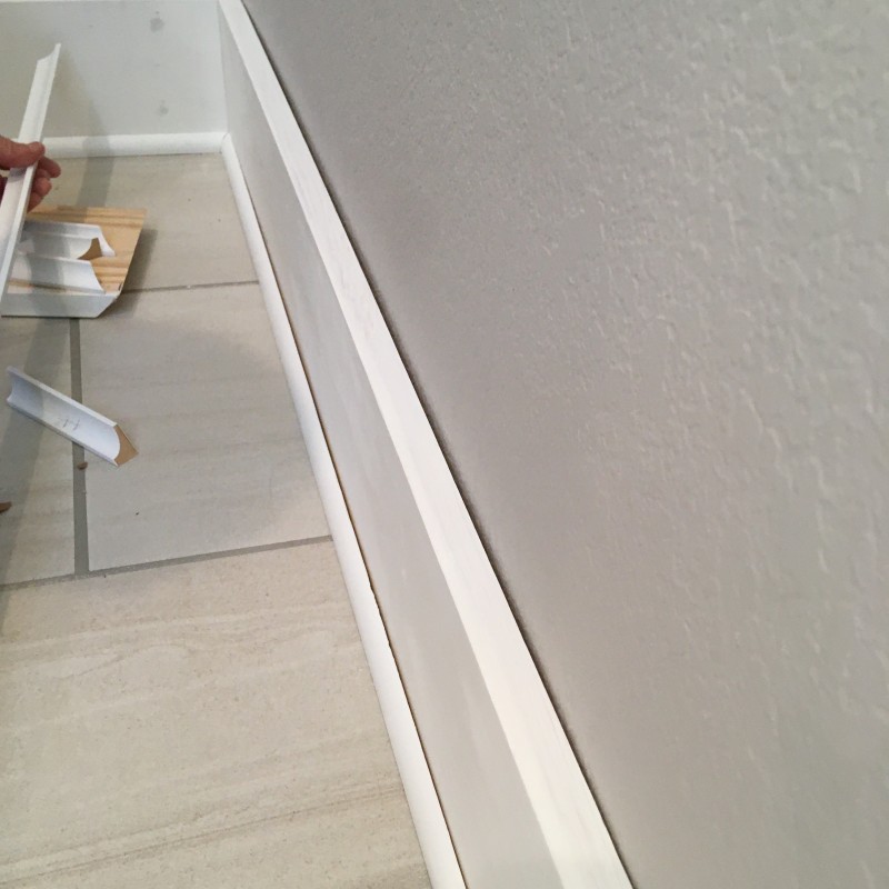 A nasty gap between a baseboard and the wall